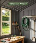 Inside view of Outdoor Storage Shed with window, visible garden tools, and hose hanging, light grey galvanized steel panels