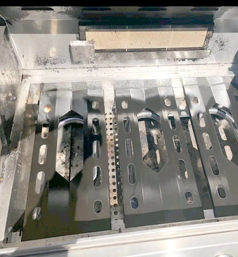 Inside view of a gas grill showing installed Three Pack Stainless Steel Heat Plates And Burners Replacement Kit for Costco Kirkland 7200108 Nexgrill 7200011 7200047U, featuring three burners and plates.