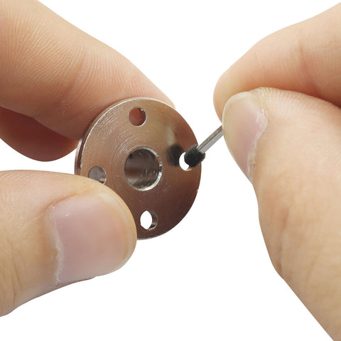 Close-up of 4 Pack 6mm Rigid Flange Couplings For DIY RC Motors, Guide Coupler Accessory Shaft Support being assembled