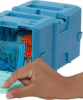 Hand opening blue storage box of Track Builder Ice Crash Playset With One Sixty Four Scale Vehicle And Ten Component Parts For Kids