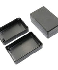 Waterproof Electrical Junction Box Set Built Tough With Durable ABS Plastic For DIY Projects And Power Supplies, Weatherproof Dustproof Enclosures, 3.15 x 1.97 x 1.38 In, Snap Ring Design For Clean Safe Cable Runs. Open and closed black ABS junction boxes