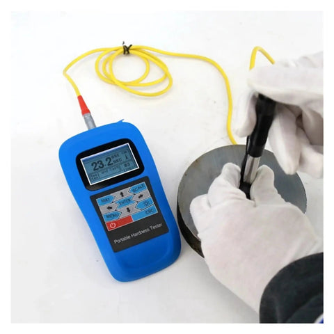 Dead On Reading Digital Leeb Hardness Tester With Beefy Metal Housing And Simple Usb Pc Hookup For Rockwell Brinell Vickers Scale Gauge Job Plus Crisp Backlit Lcd Screen Gear in use on metal surface.