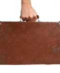 Two Brown Leather Luggage Handles With Metal Mounts, 110mm Long Pull Handles For Trunk, Bag, Briefcase, shown on a suitcase