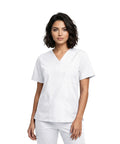 Unisex Relaxed Fit V Neck 3 Pocket Scrub Top With Breathable Side Vents For Nurses Doctors White Medium worn by model.