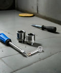 Heavy-Duty Knockdown Cam Locks And Dowel Bolts With Threaded Studs For That No-Sweat Drawer And Cabinet Assembly A 40-Piece Top-Shelf Furniture Hardware Kit To Kickstart Your Next Build Effortlessly, featuring silver steel cam locks and dowels on a work surface.