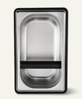 Built Like A Tank Stainless Steel Knock Box With Removable Interior Grounds Bin For Espresso Setups and Home Baristas Made For Busy Coffee Shops Without The Headache Featuring Durable Metal Construction top view of stainless steel interior with black frame