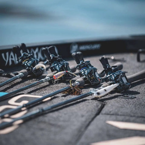 Four fishing rods with Laguna LT Spinning Reel 3 Plus 1 Ball Bearings 5.3 to 1 Gear Ratio on boat deck for freshwater use