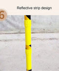Yellow pole with reflective strip design on construction site