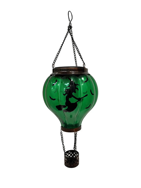 Halloween Outdoor Decoration Hot Air Balloon Solar Lantern With Flickering Flame Hanging Lanterns For A Spooky Witch Vibe Waterproof Garden Patio Decor For Halloween Party featuring a green glass balloon with a witch silhouette and chain hanger.