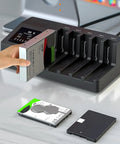 Five Bay Hard Drive Enclosure Copier Box For Offline Cloning Sata Ssd And Hdd Delivering 5Gbps Through Usb 3.0 in use with drives being inserted.