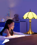 Tiffany Style Table Lamp With Yellow Stained Glass, Cozy Glow For Bedroom And Living Room, 12 X 12 X 18 Inches, LED Bulbs Included beside child