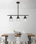 Dope 3 Light Farmhouse Black Kitchen Island Pendant Light With Clear Seeded Glass And Adjustable Rods above dining table
