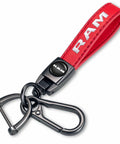 Slick Genuine Leather Car Key Chain Ring Compatible With Dodge Ram 1500 2500 3500 Featuring A Hella Sturdy Zinc Alloy Charm And Top Shelf Finish For Your Daily Driver In Vibrant Red, displaying red leather strap with RAM logo and zinc alloy clip.