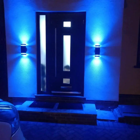 Outdoor Wall Light With RGB Color Changing And Warm White, 1000lm, RGB-CCT, illuminating a doorway with a blue glow