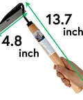 Hand holding Workhorse Weeding Sickle For Precision Weed Removal In The Yard Durable Japanese Made Nejiri Gama Style Tool, 13.7 inch length