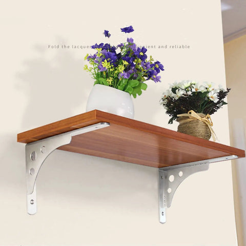 Heavy Duty Shelf Brackets Built Tough For Wall Mounted Floating Shelves Stainless Steel L Bracket supporting a wooden shelf with flowers.