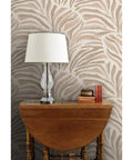 Total Knockout Modern Animal Print Vinyl Wallpaper Featuring A Slick Leather Texture Dang Durability Commercial Grade Wallcovering Easy Paste Install Home Upgrade in beige with a lamp and books on table.