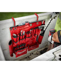 Workhorse Aerial Tool Apron In Bright Red Designed For Power Line Crews With Ample Storage Pockets holding various hand tools.