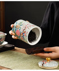 Premium Vintage Enamel Ceramic Tea Storage Jar Airtight Large Capacity Dry Food Canister For Coffee Beans Spices Nuts And Loose Leaf Tea, holding tea leaves.