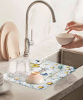 Pastoral Daisy And Butterfly Dish Drying Mat For Kitchen White Wood Grain Absorbent Counter Pad Soft Polyester For Dishes Utensils Pots And Camping 18 By 24 Inches in use on countertop with drying dishes