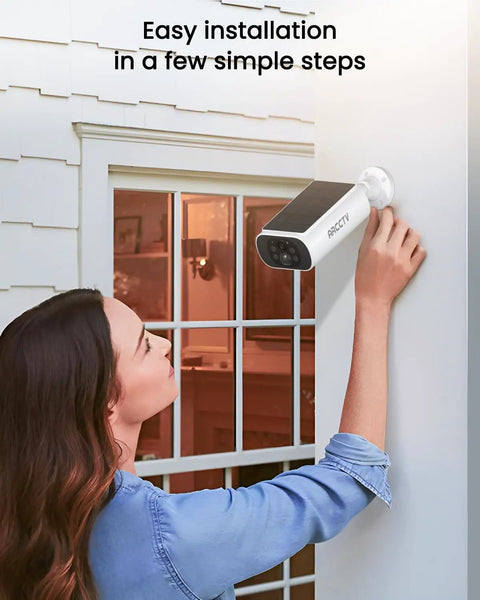 Woman installing Solar Outdoor Security Cameras Wireless 4 Camera Kit 4MP System With Color Night Vision Motion Detection No Monthly Fee