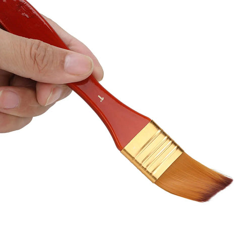 Hand holding brush from Watch Cleaning Brush Set With Red Wooden Handles And Heads, 10 Sizes, Precision Movement Maintenance Tools