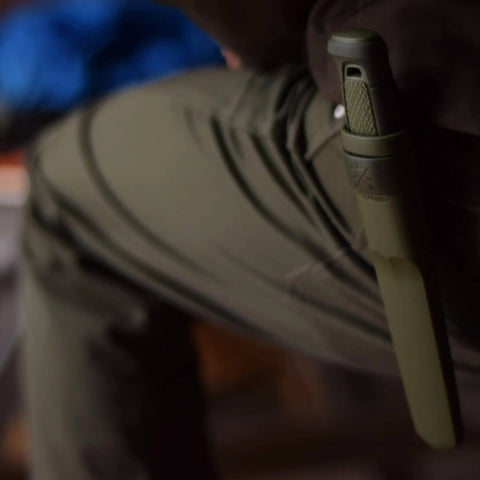 Person wearing Kansbol Fixed Blade Survival Knife With Sheath in Military Green on belt, side view