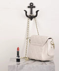Nautical Sea Anchor Wall Hooks Set Of Four Cast Iron Vintage Coat Rack Heavy Duty Hangers For Bathroom Hallway Rustic Farmhouse Home Decor Built Different With Mounting Screws Black, holding a handbag.