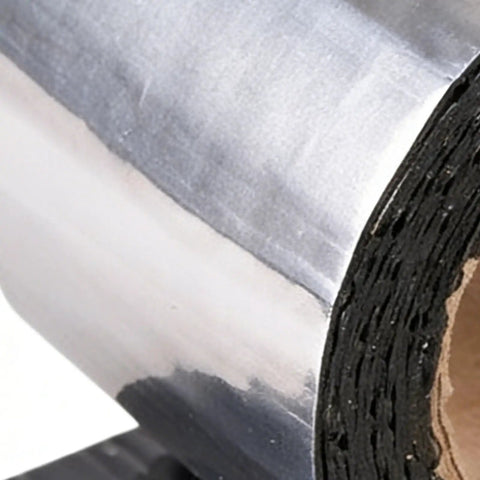 Close-up of Self Adhesive Asphalt Sealer Tape For Waterproof Crack Repair roll, showcasing aluminum backing, durable for joint sealing.