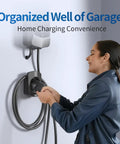 Hella Secure Ev Charger Holder Wall Mount For Sae J1772 Type 1 Cable Organizer mounted on wall with user handling cable.