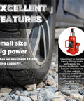 Red 12-ton hydraulic bottle jack with carrying handle inset beside a car wheel on rocky ground.