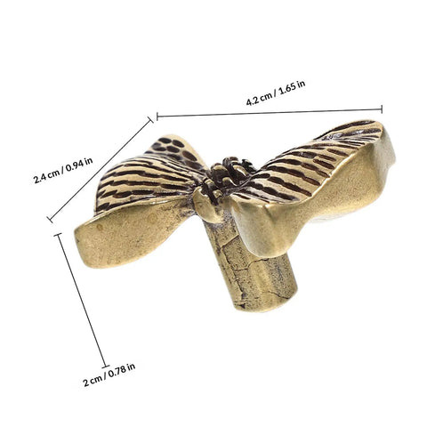 Copper Bowknot Cabinet Handle And Drawer Pull Kit In Vintage Brass Finish with measurements shown for kitchen cabinets and dressers.