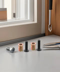 Wood Furniture Screws And Threaded Inserts Kit For Solid Hidden Installations with long screws and metal nut inserts on table