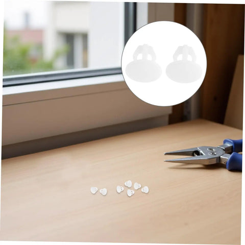 Anchor-Shape LED Strip Clips White Plastic Mounting Brackets on desk beside scissors for easy installation