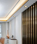 Top Shelf 15 Piece Set Of Sleek Black Brass Led Recessed Ceiling Lights Offering Flawless 3000K To 6000K Color Shifts For Easy Remodel Projects With Zero Glare Smooth Trim And Rock Solid Brushed Metal Housing illuminating a modern interior.