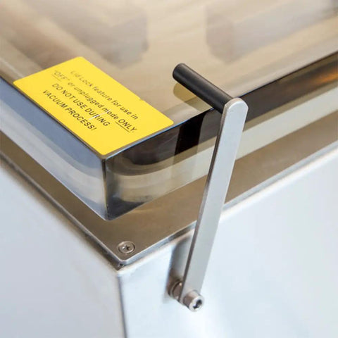 Built Tough Chamber Vacuum Sealer With Dual 19 5 Inch Bars And One 37 Inch Rail showing locking mechanism and control label.