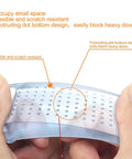 Close-up of Clear Flexible Door Stop Wedges with Adhesive Backing showing flexible TPR material and protruding dot design.