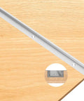 Tough As Nails Aluminum T Track With Double Cut Profile And Predrilled Mounting Holes For Woodworking Jigs and Fixtures, shown on wood surface.