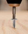 Phillips Truss Head Wood Screws Stainless Steel 410 Self Tapping Pro Grade Assortment Kit With Multiple Lengths From Half Inch To Two Inches For Woodworking Furniture DIY Projects shown being drilled into wood