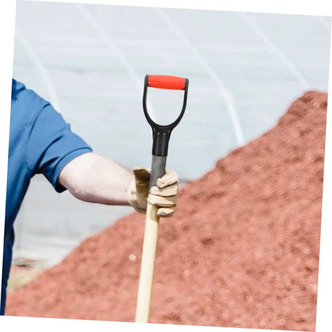 2 Pack Shovel Handle Replacement Grips No Fuss Install Ergonomic Comfort Non Slip Grip For Snow Shovels Weather Resistant Durable Replacement Part For Winter Cleanup And Yard Work gripped by a person in a blue shirt, showing the handle grip outdoors next to a pile of red mulch.