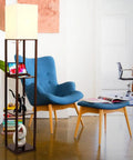 Maxwell Charger Shelf Floor Lamp With USB Ports And Electrical Outlet next to blue chair, corner display lamp with shelves