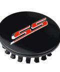 Fresh Set Of Four 68 Millimeter Stainless Steel Wheel Center Caps Featuring Raised Double Slash SS Badges For Chevy Camaro Rim Covers close-up view.