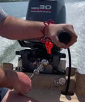 Adjustable Manual Boat Jack Plate For Up To 30HP Outboard Motors High Grade Marine Aluminum Construction Fastest Manual Jack Plate On The Market Raise And Lower In Seconds On Demand On Water Adjustability For Quick Smooth Motor Positioning used in a boat on the water.