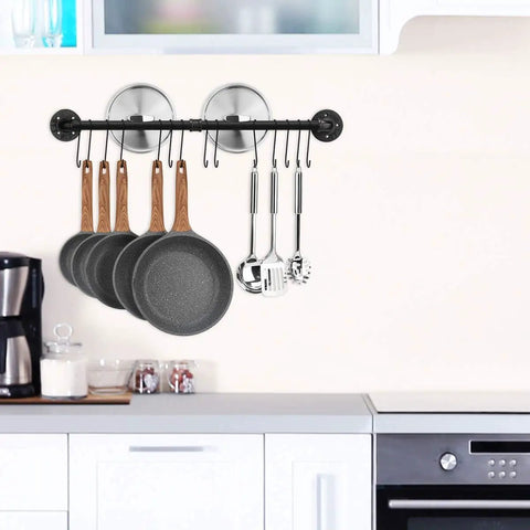 31.5 Inch Wall Mounted Pot Rack With Detachable Pan Lid Organizer And 14 Hooks Heavy Duty Iron In Matte Black For Kitchen Utensils Pots Pans And Lids Storage Keeps Your Kitchen Neat And On Point shown in a kitchen setup with hanging utensils and pans.