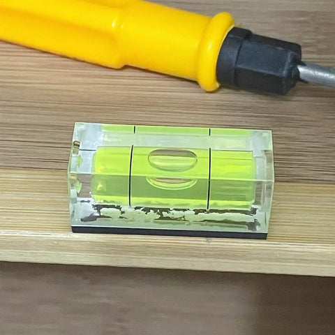 Two Pack Magnetic Bubble Level Set With Magnetic Base 15mm By 15mm By 40mm Compact Single Line Small Square Layout Tool on wood surface
