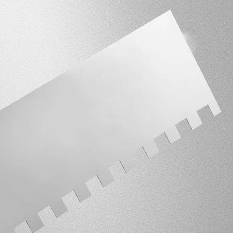 Close-up of stainless steel square notched trowel from 5 Piece Square Notched Trowel Set with Pro Grade Stainless Steel Trowels