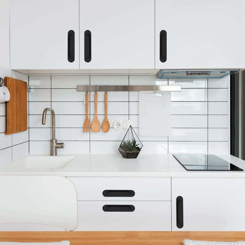 2 Pack Matte Black Flush Pull Barn Door Handles 6 Inch installed on white kitchen cabinets and drawers