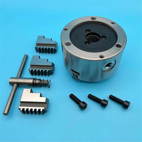 Solid K11-100 Mini 100MM Lathe Chuck With Three Self Centering Jaws for Metalworking Projects with accessories and screws.