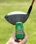 Hand holding anti-slice golf rub near a golf club head, fix your slice instantly hit straighter and longer drives reduce spin.