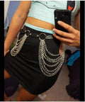 Edgy Layered Belly Chain Made From Distressed Leather And Antique Alloy Links A Universal Fit, styled over a black skirt.
